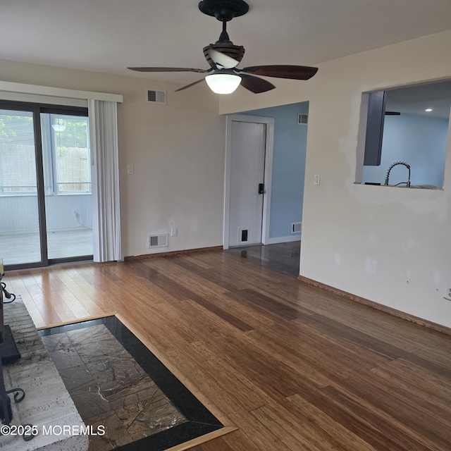 56 Georgetown Blvd, Barnegat, NJ 08005 - unfurnished living room featuring wood finished floors, ceiling fan, baseboards, and a sink