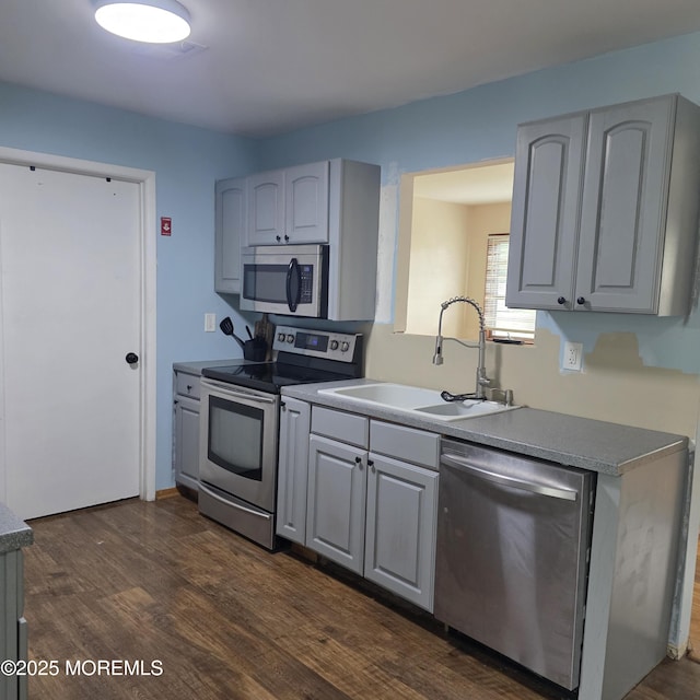56 Georgetown Blvd, Barnegat, NJ 08005 - kitchen with stainless steel appliances, a sink, dark wood-style flooring, and gray cabinetry