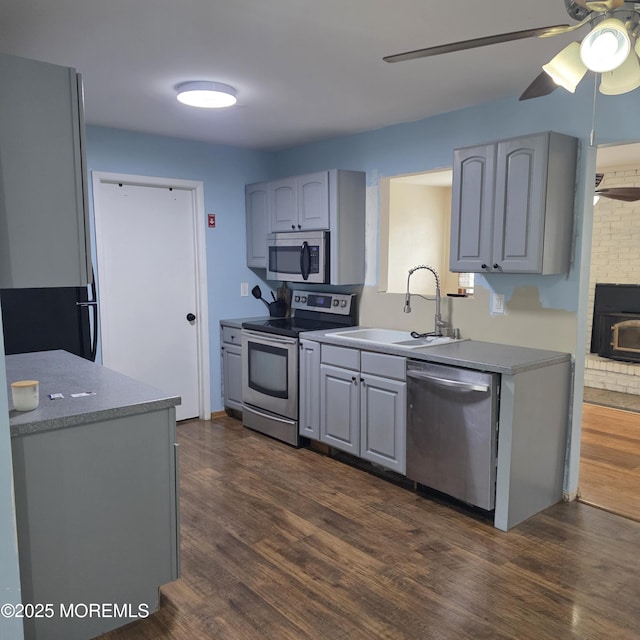 56 Georgetown Blvd, Barnegat, NJ 08005 - kitchen featuring appliances with stainless steel finishes, a sink, a ceiling fan, and dark wood-type flooring
