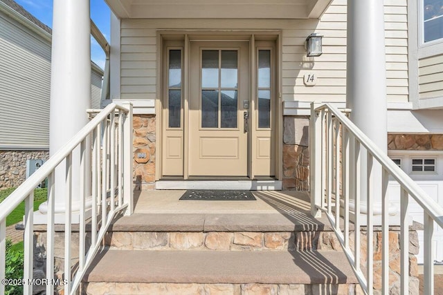 entrance to property with stone siding