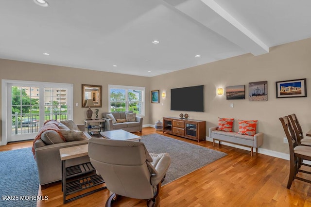 living area featuring light wood-style floors, recessed lighting, and baseboards