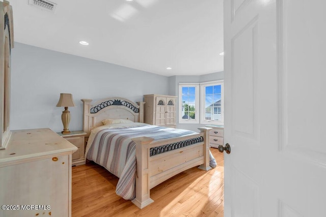 bedroom featuring light wood-style floors and recessed lighting