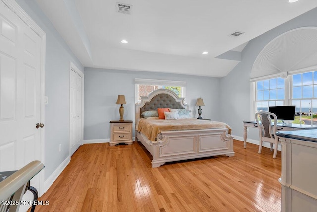 bedroom featuring light wood-type flooring, baseboards, and recessed lighting