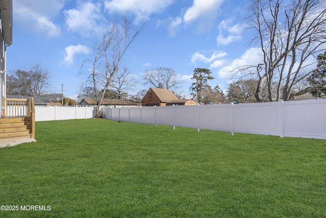 view of yard featuring a wooden deck