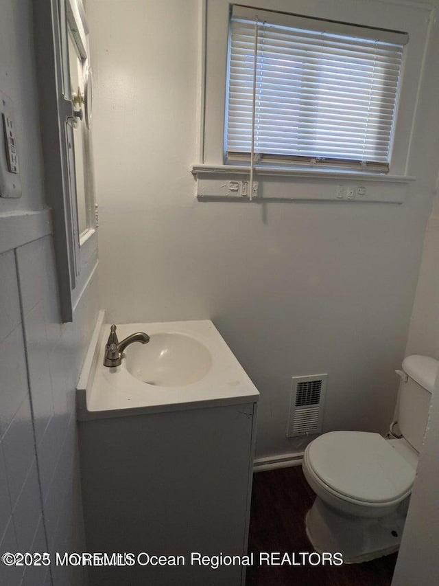 half bath with toilet and vanity