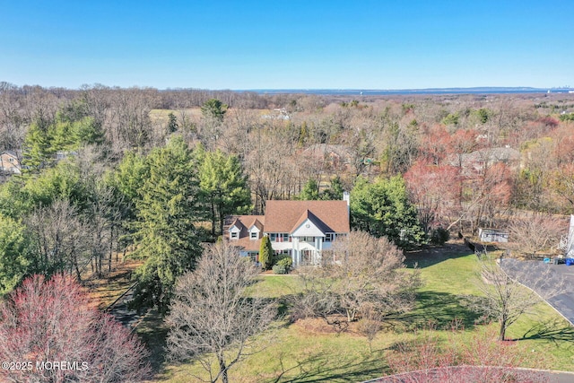 view from above of property featuring a forest