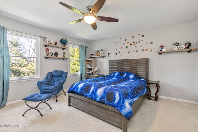 bedroom with carpet, baseboards, and a ceiling fan
