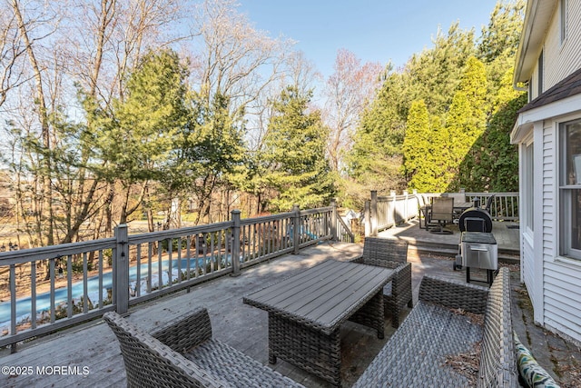 deck featuring outdoor dining area
