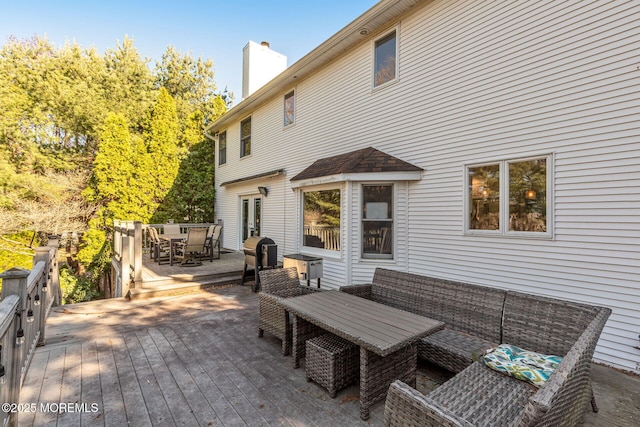 wooden deck with outdoor dining area