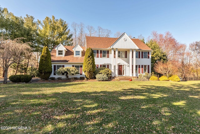 neoclassical / greek revival house with a front lawn