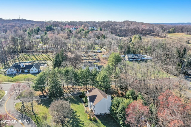 aerial view of property's location with a forest