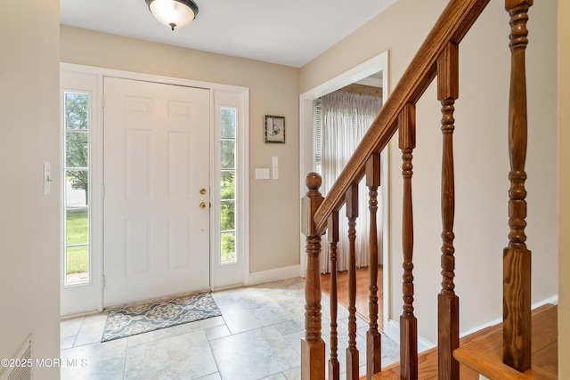 24 Statesboro Rd, Freehold, NJ 07728 - foyer entrance with healthy amount of natural light and baseboards