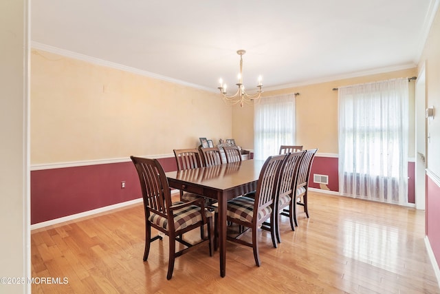 24 Statesboro Rd, Freehold, NJ 07728 - dining space with a chandelier, light wood-type flooring, baseboards, and ornamental molding