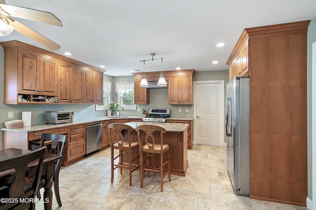 24 Statesboro Rd, Freehold, NJ 07728 - kitchen featuring stainless steel appliances, a sink, recessed lighting, a center island, and light stone finish flooring