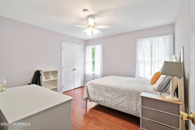 24 Statesboro Rd, Freehold, NJ 07728 - bedroom with wood finished floors, a closet, and a ceiling fan