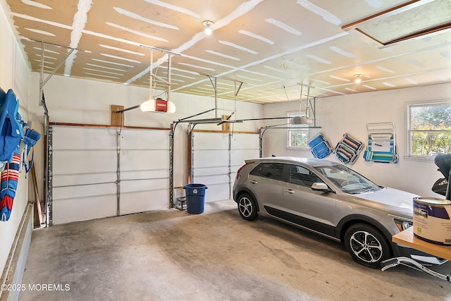 24 Statesboro Rd, Freehold, NJ 07728 - garage featuring a garage door opener