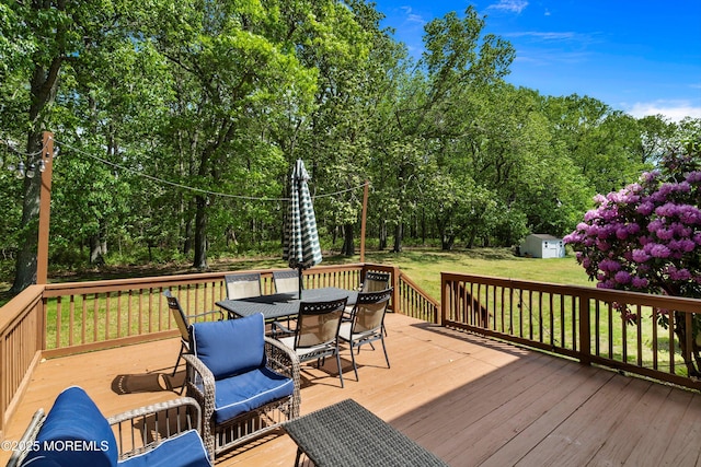 24 Statesboro Rd, Freehold, NJ 07728 - wooden terrace with outdoor dining space, a yard, and view of scattered trees