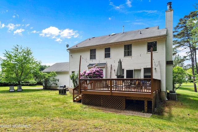 24 Statesboro Rd, Freehold, NJ 07728 - rear view of house featuring a wooden deck, a lawn, a chimney, and central AC unit