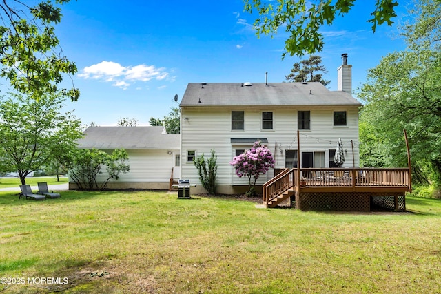 24 Statesboro Rd, Freehold, NJ 07728 - back of house with a wooden deck, a chimney, and a lawn