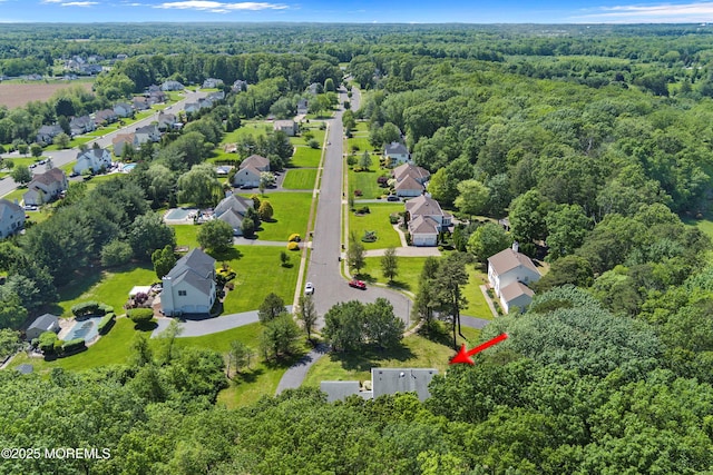 24 Statesboro Rd, Freehold, NJ 07728 - aerial overview of property's location with a forest and nearby suburban area