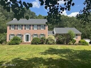 24 Statesboro Rd, Freehold, NJ 07728 - colonial inspired home featuring a front yard
