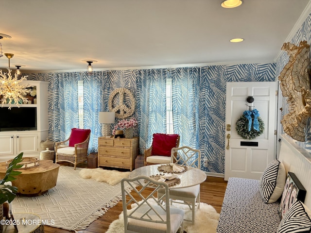 21 Mount St Unit C-1, Bay Head, NJ 08742 - sitting room with wallpapered walls, wood finished floors, crown molding, and a chandelier