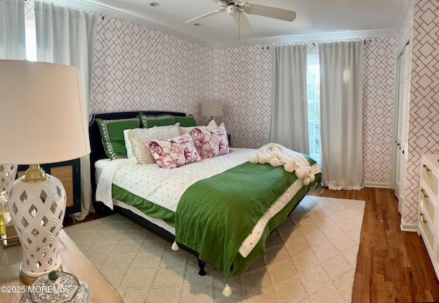 21 Mount St Unit C-1, Bay Head, NJ 08742 - bedroom featuring ornamental molding, wallpapered walls, wood finished floors, and ceiling fan
