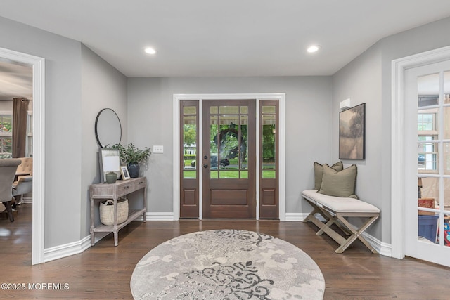 entryway with wood finished floors, recessed lighting, and baseboards