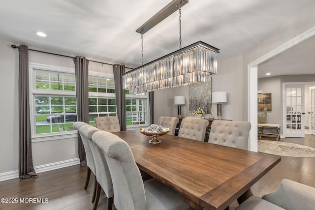 dining space with healthy amount of natural light, baseboards, wood finished floors, and recessed lighting