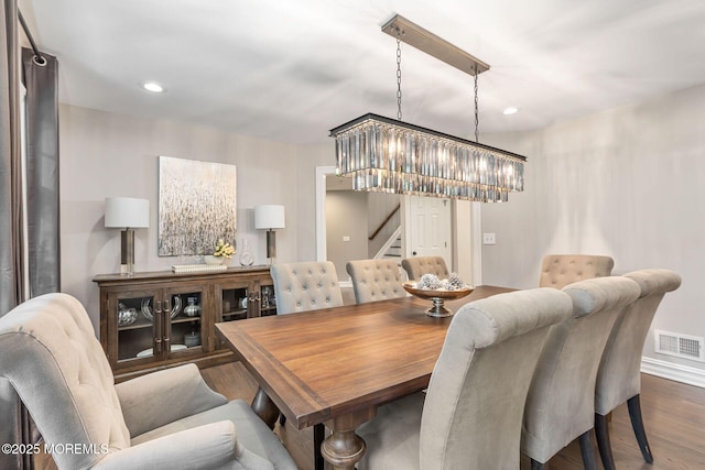 dining space with stairway, wood finished floors, and recessed lighting