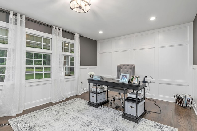home office featuring a decorative wall, dark wood-style flooring, recessed lighting, and a wainscoted wall