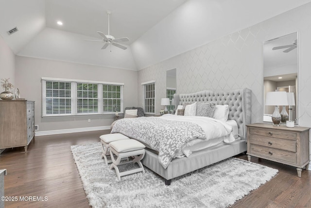 bedroom with lofted ceiling, wood finished floors, baseboards, wallpapered walls, and recessed lighting