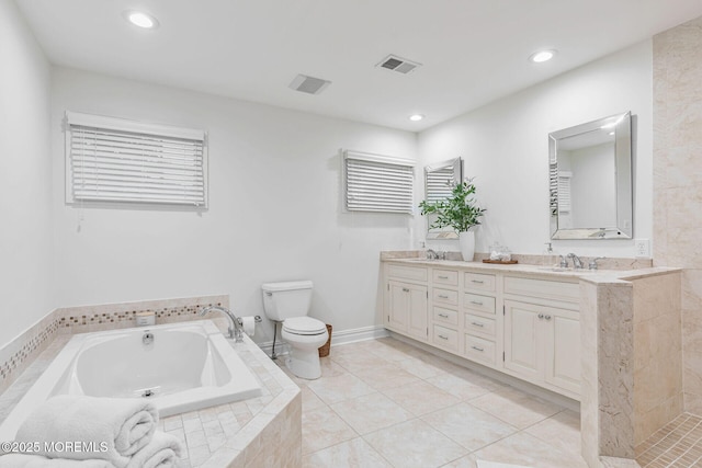 full bathroom featuring toilet, a garden tub, double vanity, recessed lighting, and tile patterned floors
