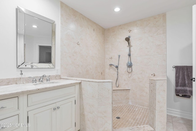 bathroom featuring a walk in shower, vanity, recessed lighting, and tile patterned floors