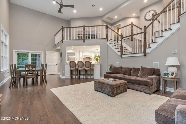3 Ardmore Pl, Holmdel, NJ 07733 - living room featuring dark wood finished floors, ceiling fan, a towering ceiling, stairs, and recessed lighting