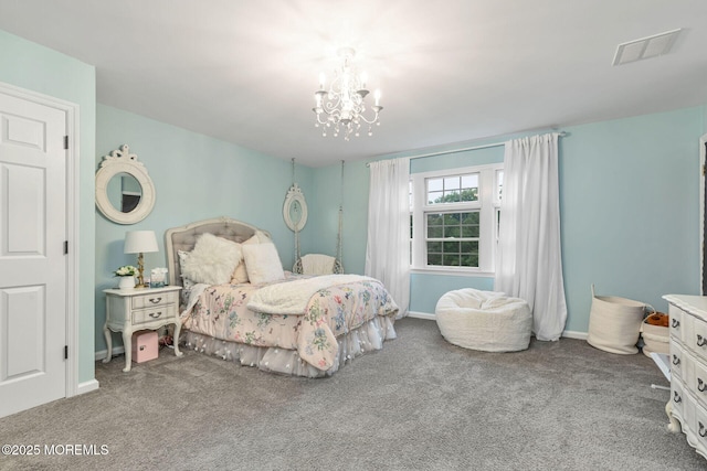 carpeted bedroom featuring a chandelier and baseboards