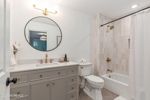 full bathroom featuring toilet, vanity, tile patterned floors, and shower / bath combo