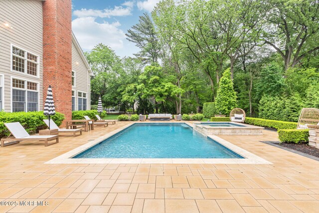 3 Ardmore Pl, Holmdel, NJ 07733 - view of pool with a patio, a pool with connected hot tub, and view of wooded area