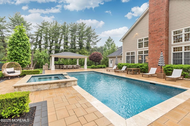 view of pool with a gazebo, a patio area, and a pool with connected hot tub