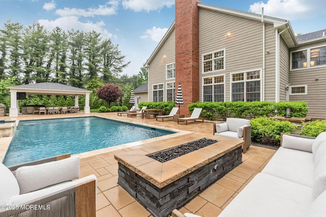 outdoor pool featuring a gazebo and a patio