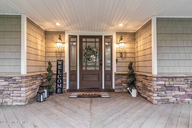 3 Ardmore Pl, Holmdel, NJ 07733 - doorway to property featuring stone siding and covered porch