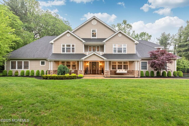 3 Ardmore Pl, Holmdel, NJ 07733 - view of front of house with stone siding, a porch, a front yard, and roof with shingles