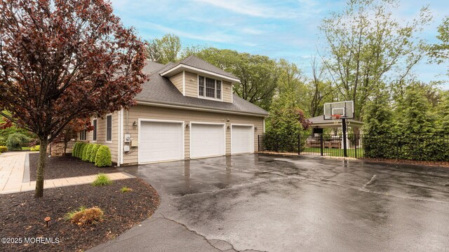 3 Ardmore Pl, Holmdel, NJ 07733 - view of side of property with asphalt driveway, fence, and roof with shingles