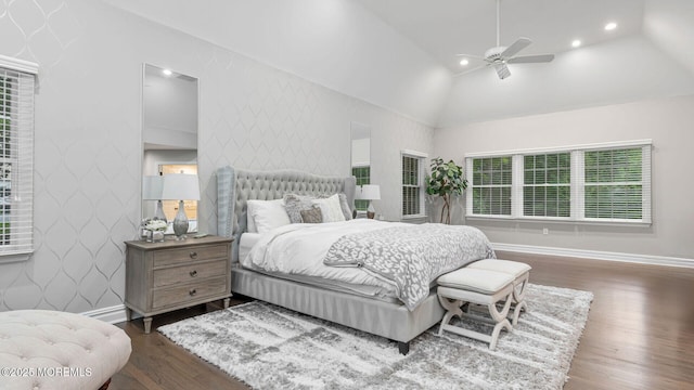 bedroom with wood finished floors, lofted ceiling, baseboards, ceiling fan, and recessed lighting