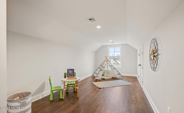 recreation room with wood finished floors, lofted ceiling, baseboards, and recessed lighting