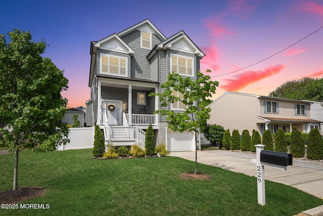 view of front of house with driveway, an attached garage, board and batten siding, stairway, and covered porch