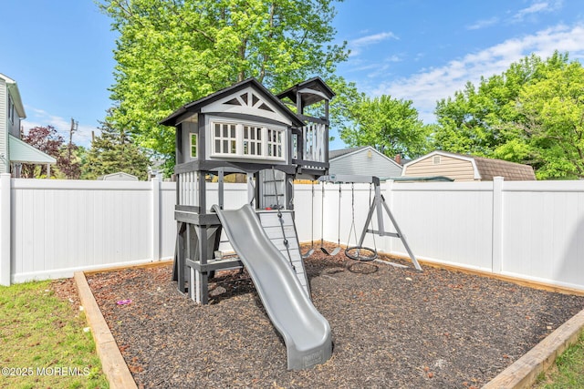 view of play area with a fenced backyard
