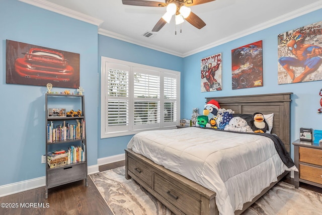 bedroom featuring ornamental molding, baseboards, wood finished floors, and ceiling fan