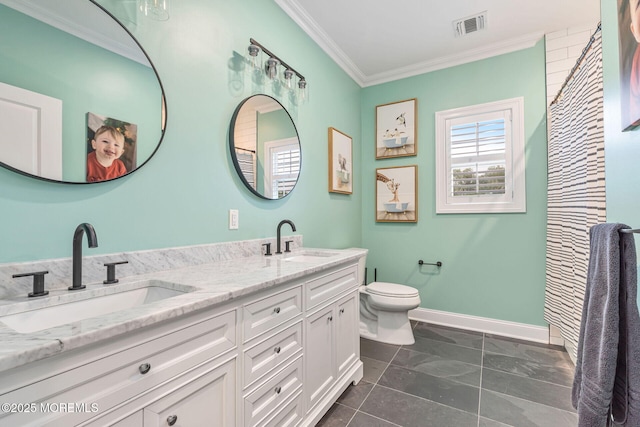bathroom with crown molding, toilet, baseboards, and double vanity