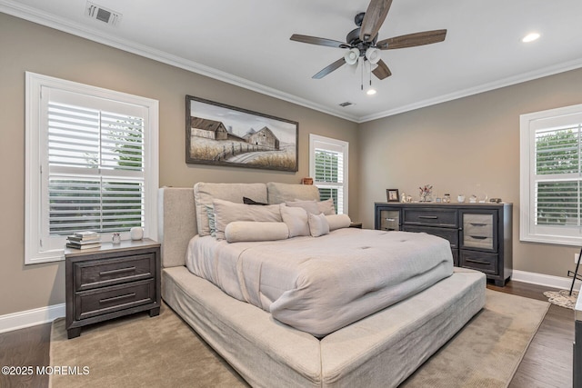 bedroom with baseboards, crown molding, multiple windows, recessed lighting, and light wood-style floors